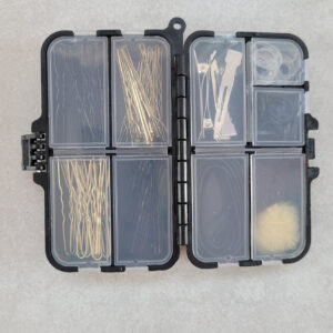 Black box with clips, nets and rubber bands 